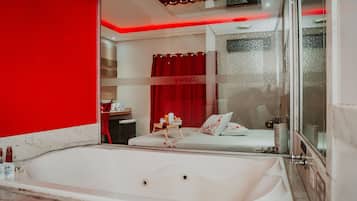 Honeymoon Suite | Bathroom | Hair dryer, children's dressing gowns, slippers, bidet