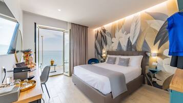 Habitación Deluxe, vista al mar | Ropa de cama de alta calidad, camas con efecto memoria y minibar