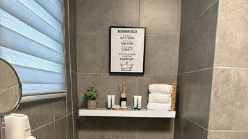 Shower, hair dryer, towels, soap