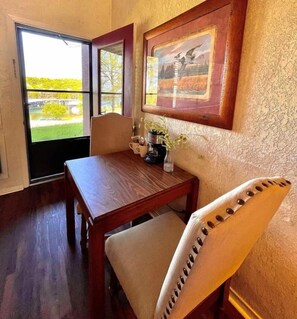 Enjoy meals at the dining table with a view of the outdoors.
