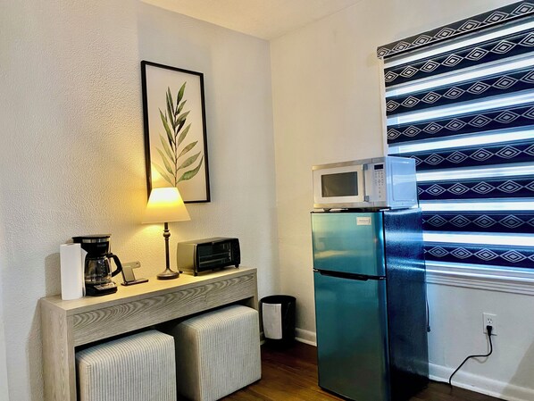 A compact kitchenette with a microwave, toaster, and refrigerator. - Magnolia Suite Vacation Home -Private Entry, Old Canton N. Jackson (Jackson)