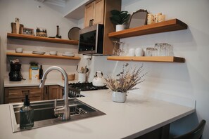 Panoramic Apartment | Private kitchen | Microwave, coffee/tea maker, electric kettle, paper towels - Goldsmith's Riverfront Inn (Missoula)
