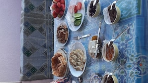 A dining table with various dishes, utensils, and a milk carton. - 9 SIDY GABAR ST NAZLET EL SMAN HARAM GIZA (Nazlet el sman-Haram)