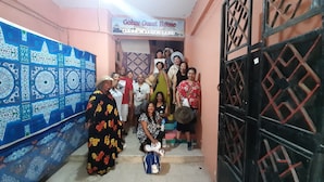 A group of people standing in a hallway with a sign above them that reads "Gohar Guest House B&B". - 9 SIDY GABAR ST NAZLET EL SMAN HARAM GIZA (Nazlet el sman-Haram)