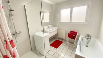 Shower, hair dryer, towels, toilet paper