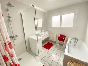 Shower, hair dryer, towels, toilet paper