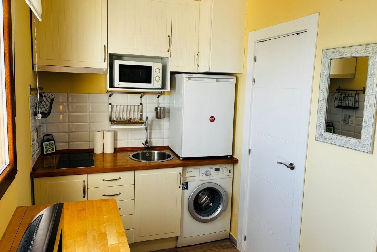 Fridge, microwave, cookware/dishes/utensils