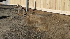 A wooden fence with a utility box in the foreground. - RV Spot #3 at Watts Bar Lake (Spring City)