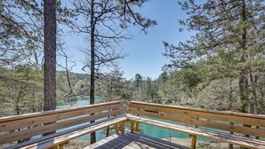 A wooden deck with benches overlooking a river surrounded by trees. - Cliffside Eureka Springs Cabin w/ Beaver Lake View (Eureka Springs)