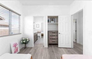 Enjoy a spacious living area with a large window, kitchen, and separate room.