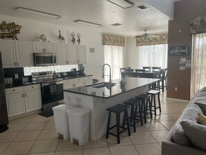 Fridge, microwave, oven, stovetop - Sunset Lake Oasis | 5 bedrooms, 5 bathrooms, pool and spa near Disney (Kissimmee)