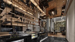A modern interior with a central bar area, multiple levels of seating, and a distinctive ceiling design. - Doubletree By Hilton Cangnan (Wenzhou)