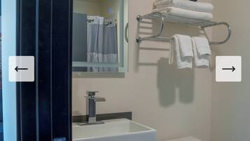Deluxe Room | Bathroom | Shower, hair dryer, towels, soap