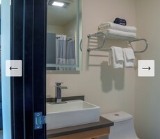 Deluxe Room | Bathroom | Shower, hair dryer, towels, soap