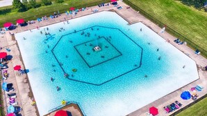 An aerial view of a large, rectangular swimming pool with multiple lanes and a central island. - Paradise in Niagara-on-the-lakes at Vine Ridge Resorts.  (Niagara-on-the-Lake)