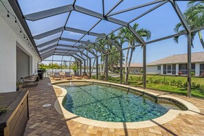 Outdoor pool, a heated pool - Stunning villa with heated saltwater pool, 4 bedrooms, 2 bathrooms and office. (Cape Coral)
