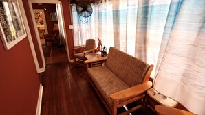 A cozy living room with a sofa, chairs, and a fan. - Luxury Funky Fun 420, Walk Downtown wAC–Pets free! (Trinidad)
