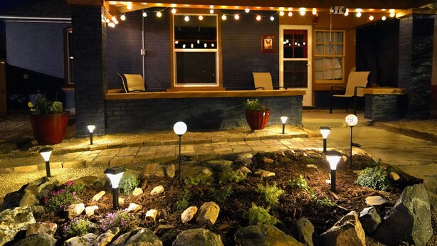 A house with a covered porch, outdoor seating, and string lights. - Luxury Funky Fun 420, Walk Downtown wAC–Pets free! (Trinidad)
