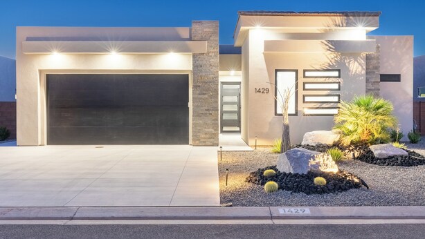 A modern house with a garage, number 1429, and a landscaped front yard with rocks and cacti. - Desert Dreaming 2 Bedroom, Den, Pet Friendly, Hot Tub EV Charger (Washington)