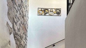 A staircase with wooden steps and a stone wall on one side. - Villa with large pool- wheelchair accessible (Dobrinj)