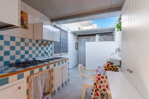 Fridge, stovetop, cookware/dishes/utensils, spices - Villa 'Bilocale A Torre Lapillo' with Shared Terrace and Air Conditioning (torre lapillo)