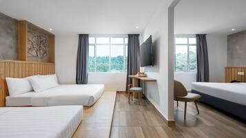 Deluxe Family Room | In-room safe, desk, laptop workspace, blackout drapes