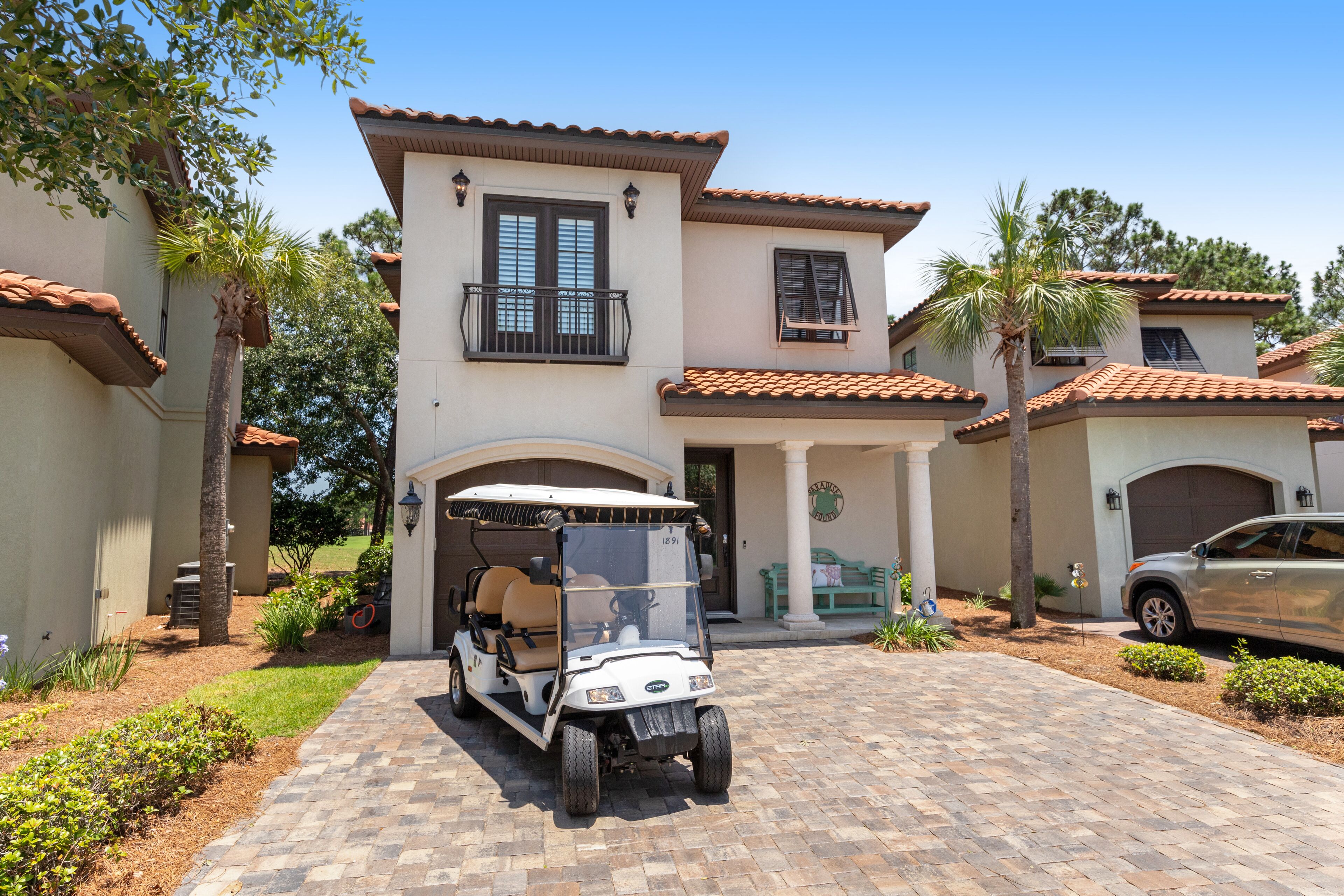 Sunny getaway with a golf cart, patio, grill, & AC - pool, hot tub, and tennis
