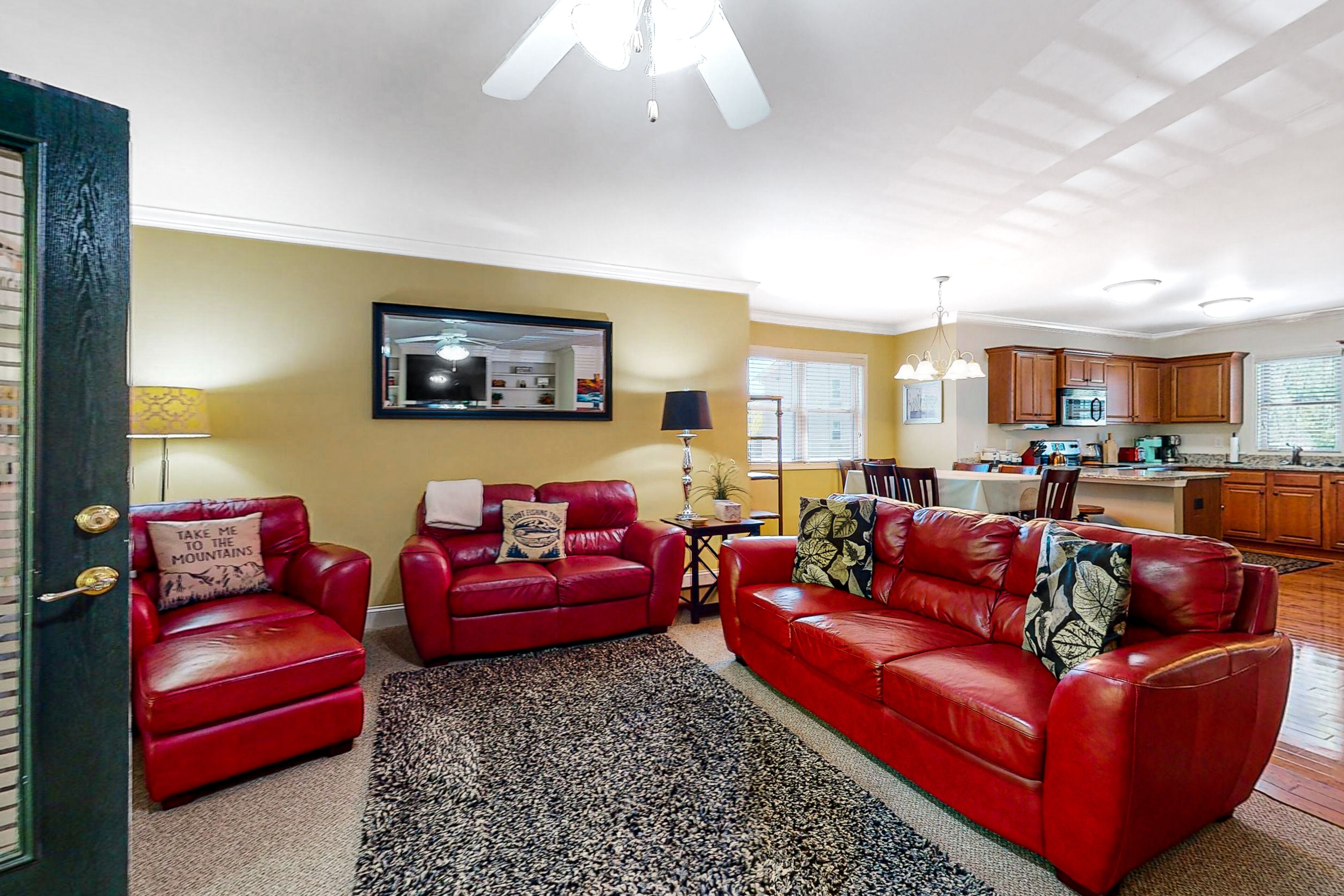 Inviting riverfront condo with fireplace, balcony, central AC, & W/D