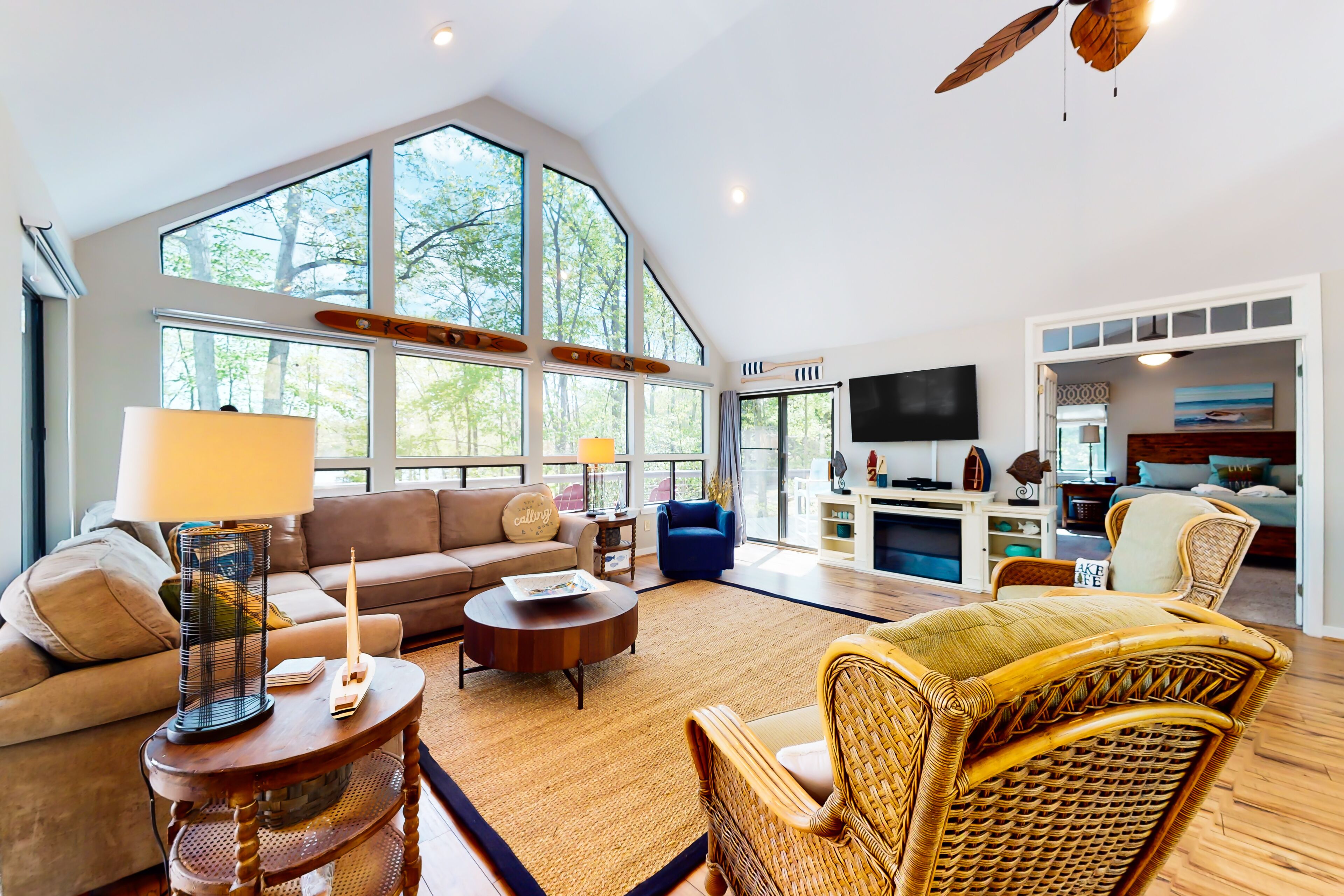 Inviting lakefront home with game room, kayaks, firepit, central AC, & W/D