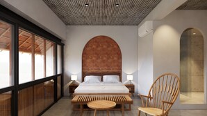 A modern bedroom with a large bed, wooden headboard, two bedside tables with lamps, a wooden bench, and a wooden chair. - TA Boutique Hotel (Da Nang)