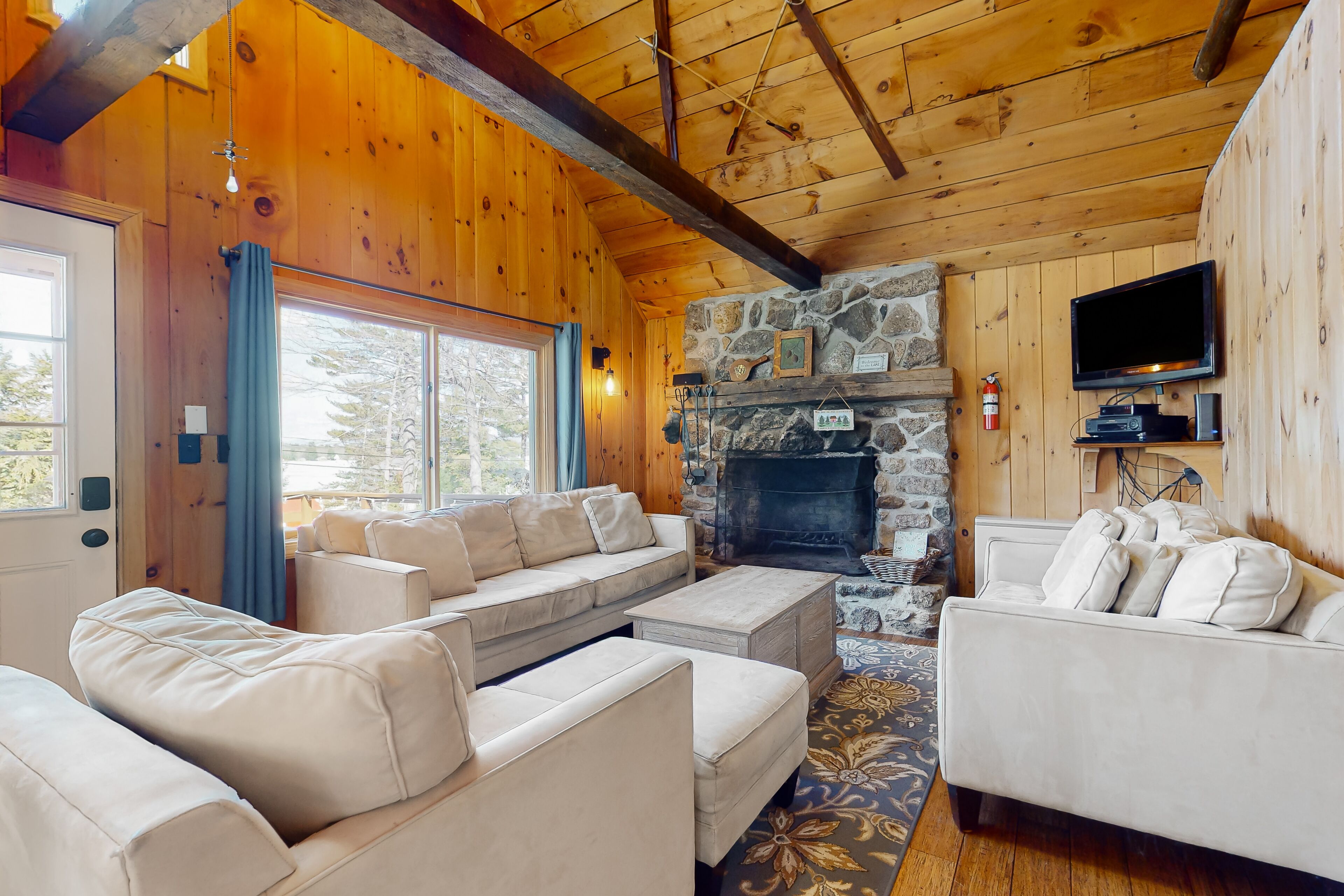 Lakeside home with water views, firepit, deck, fireplace, & W/D - dog-friendly