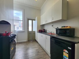 Signature Apartment | Private kitchen | Full-size fridge, microwave, oven, stovetop