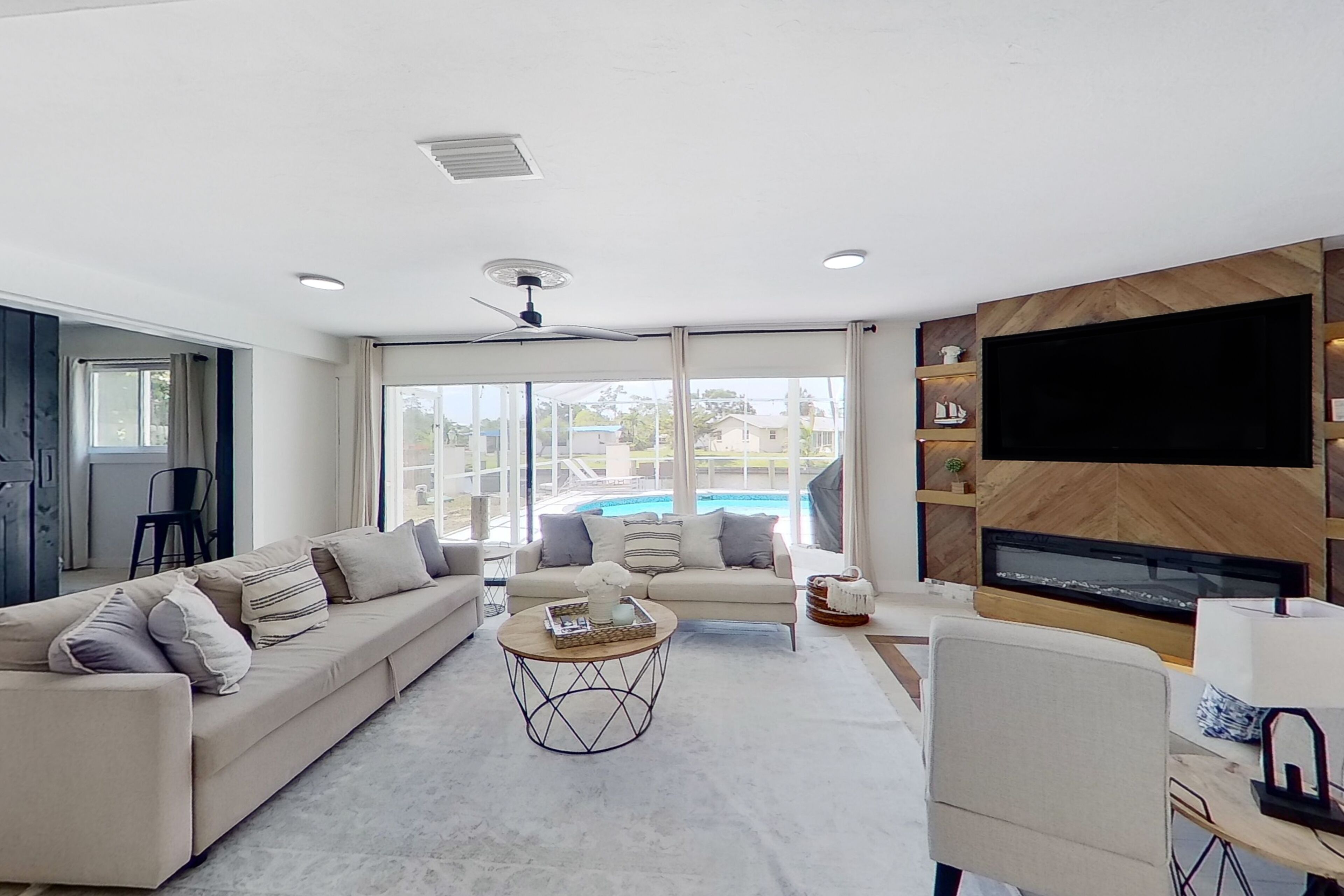 Dog-friendly home with private pool, dock, fireplace, patio, grill, & canal view