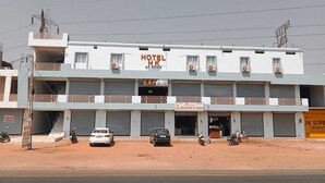 A multi-story building with a sign for 'HOTEL HK' indicating an accommodation facility.