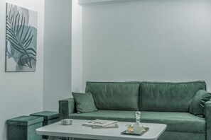 Apartamento Gallery | Sala de estar | Smart TV de 55 pulgadas con canales por cable, una televisión