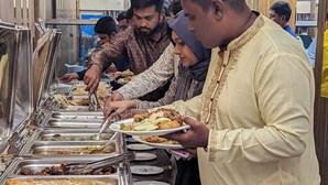 A buffet setup with multiple food stations and guests serving themselves. - Hotel Royal Bengal (Dhaka)
