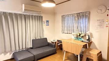 City House | Living area | 24-inch flat-screen TV with cable channels