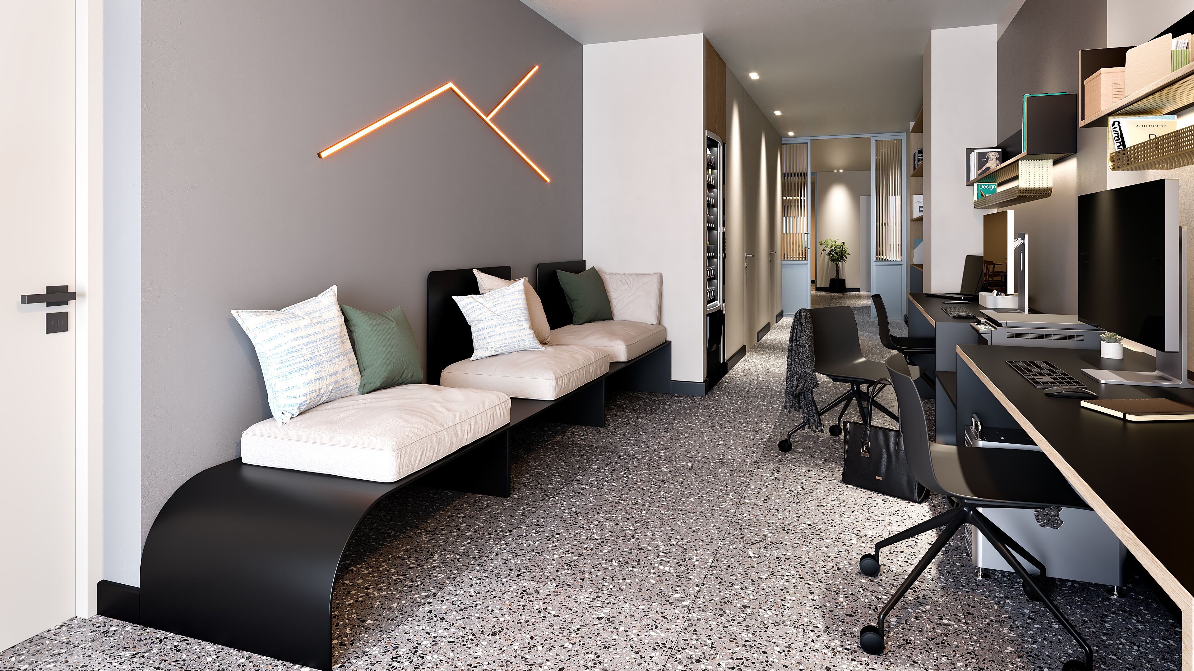 Un espace de bureau moderne avec un banc noir aux lignes courbes, un bureau avec un ordinateur et un luminaire fixé au mur.