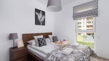 1 bedroom, desk, iron/ironing board, travel crib