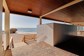 A wooden deck leading to a beach with a view of the ocean. - Albufeira Delight With Pool by Homing (Albufeira)