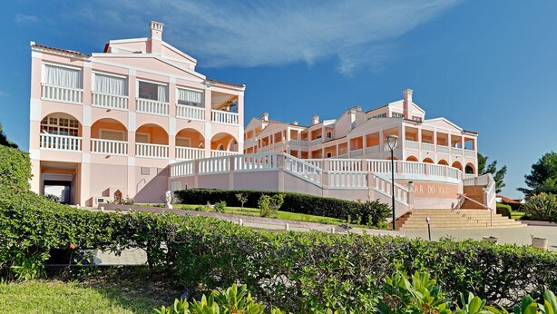 A large, multi-story building with balconies and a central staircase. - Portimão Solar DO VAU With Pool (Portimão)