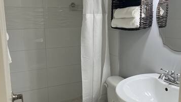 Hair dryer, towels, soap, shampoo