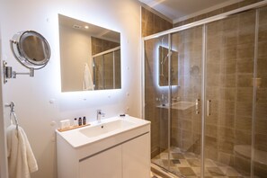 Shower, hair dryer, towels, soap