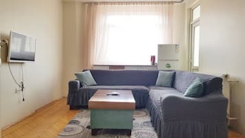 Premium Apartment | Living area | 32-inch LED TV with satellite channels, TV