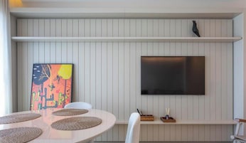 Deluxe Apartment | Living area | 32-inch TV with digital channels