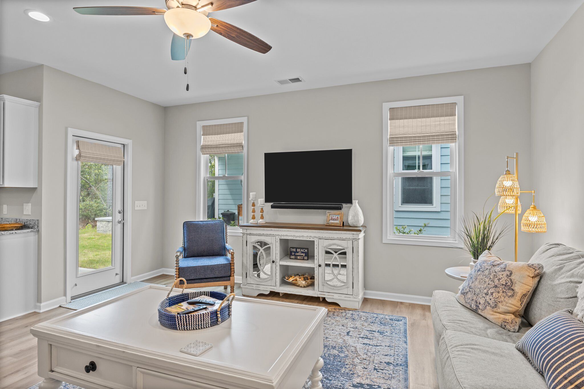 A living room with a television, sofa, and coffee table.