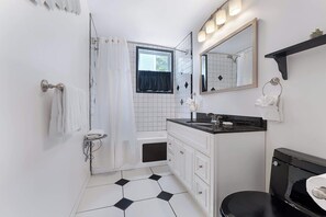 Shower, hair dryer, towels