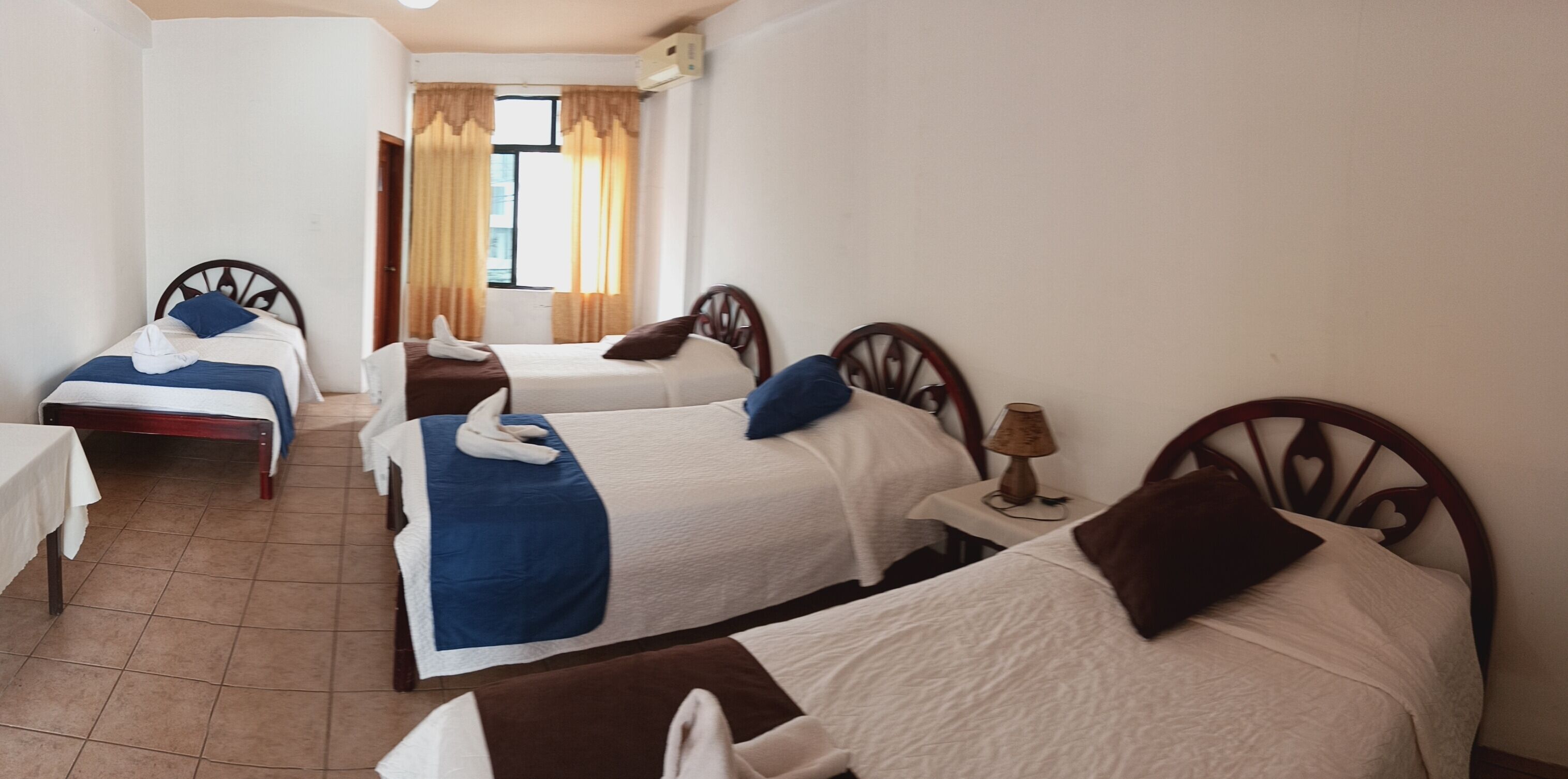 Comfort Quadruple Room | Premium bedding, down duvets, desk, laptop workspace