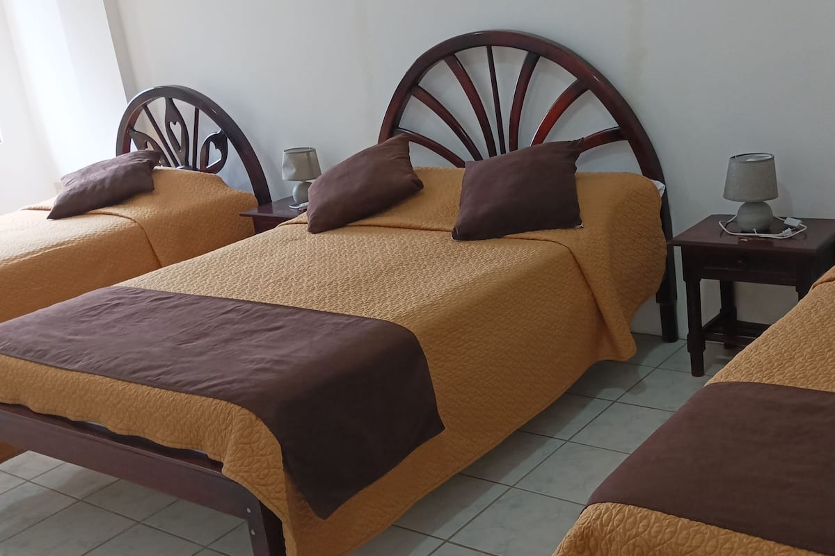 Comfort Quadruple Room | Premium bedding, down comforters, desk, laptop workspace