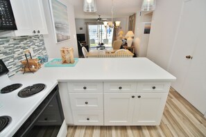 Fridge, microwave, oven, stovetop - Cozy Seaside Retreat Just Steps from the Atlantic's Waves (New Smyrna Beach)